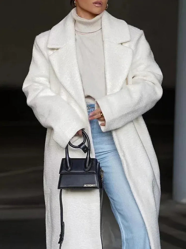 Fashionable women's cozy oversized long coat, a versatile layering piece for cold season style.
