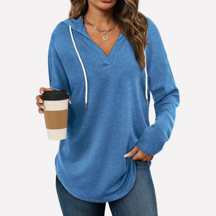 Cozy women's relaxed fit hoodie, perfect for staying warm during fall & winter.
