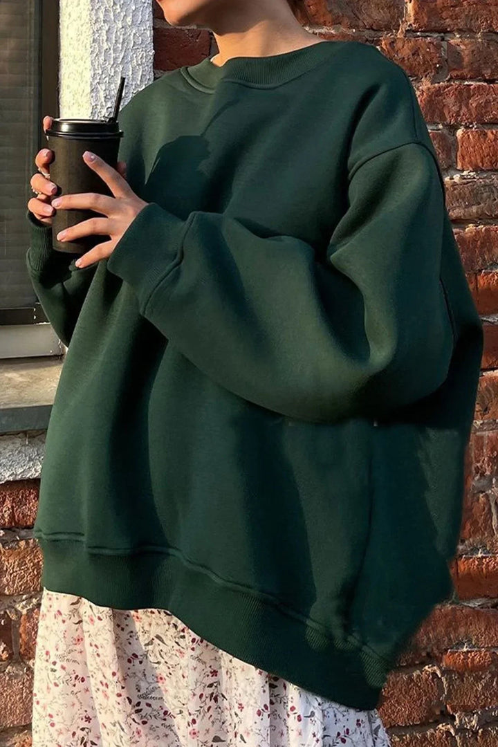 Versatile women's oversized round neck sweatshirt for effortless street style, casual looks, or cozy layering.