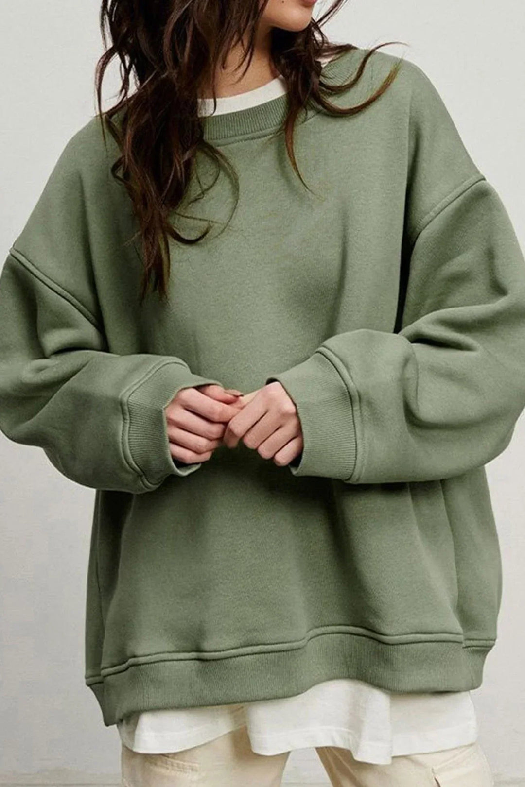 Warm & cozy women's oversized sweatshirt. Perfect round neck top for winter fashion, casual or street style.