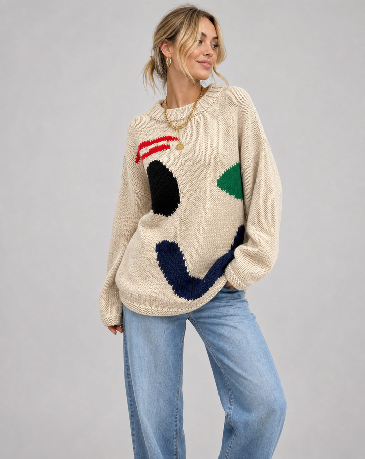 Women's cozy oversized smiley face sweater in soft knit. Perfect for casual fall and winter warmth, a trendy loose fit top.