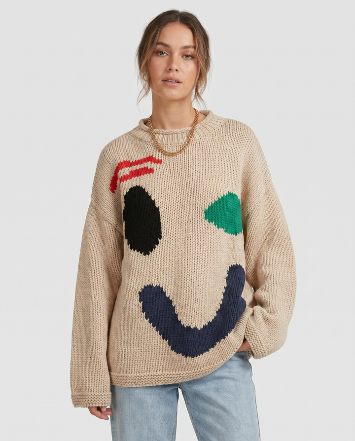 Soft texture of a women's cozy oversized knit sweater. Ideal for winter warmth and comfortable, loose fit casual wear.