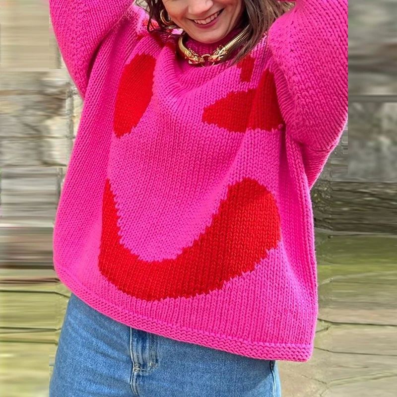 Generous loose fit of a women's oversized smiley face sweater. A cozy knit top perfect for trendy casual fall & winter.