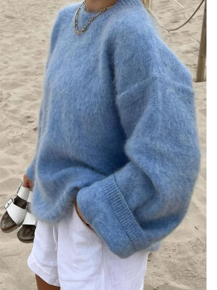 Stylish women's oversized sweater, perfect for cozy layering & comfortable winter fashion.