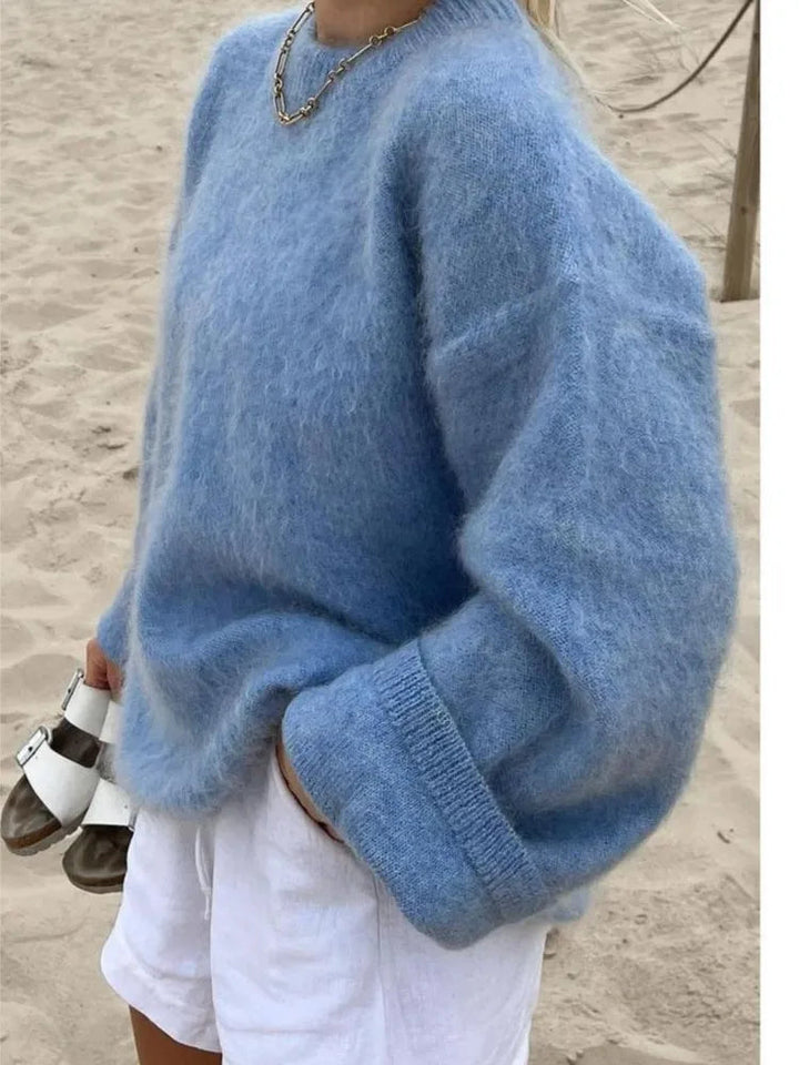 Stylish women's oversized sweater, perfect for cozy layering & comfortable winter fashion.
