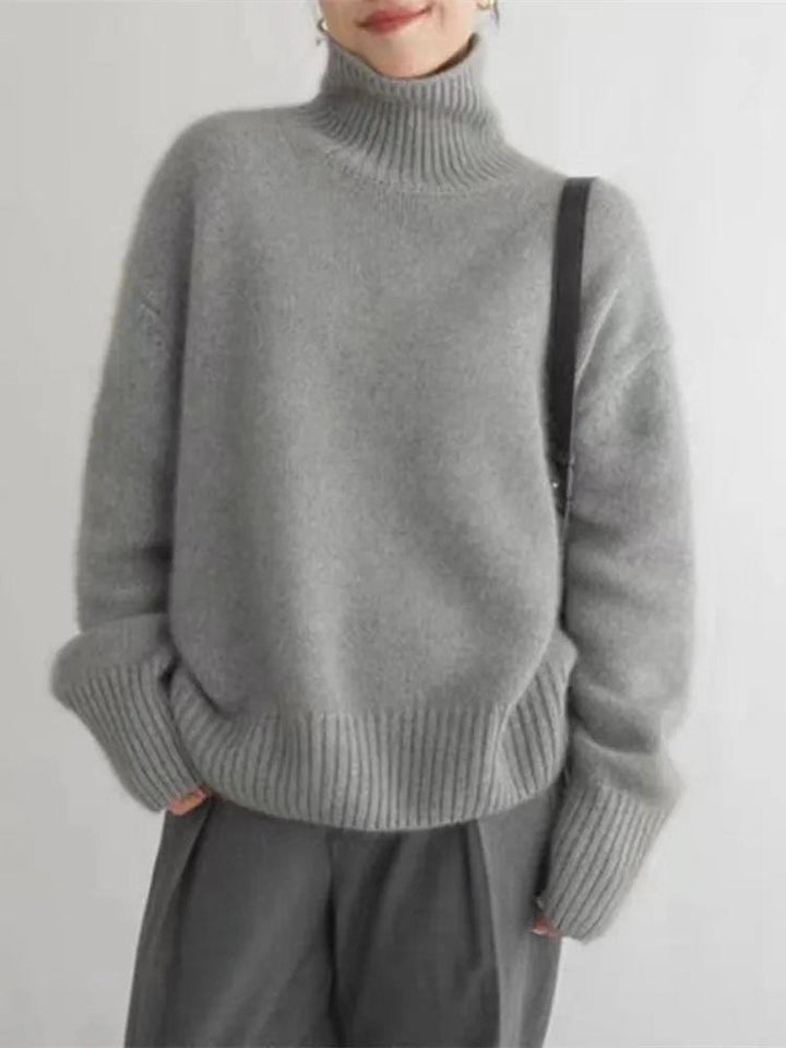 Women's soft knit turtleneck sweater with a relaxed fit, a winter fashion essential.