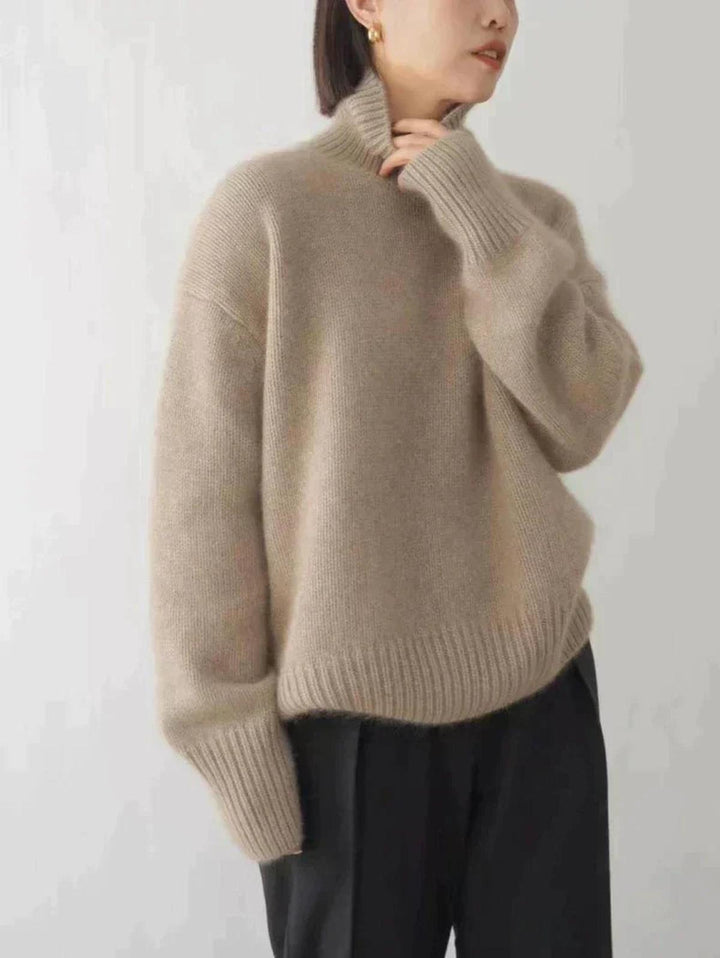 Elegant women's warm turtleneck sweater, offering cozy comfort & stylish winter appeal.
