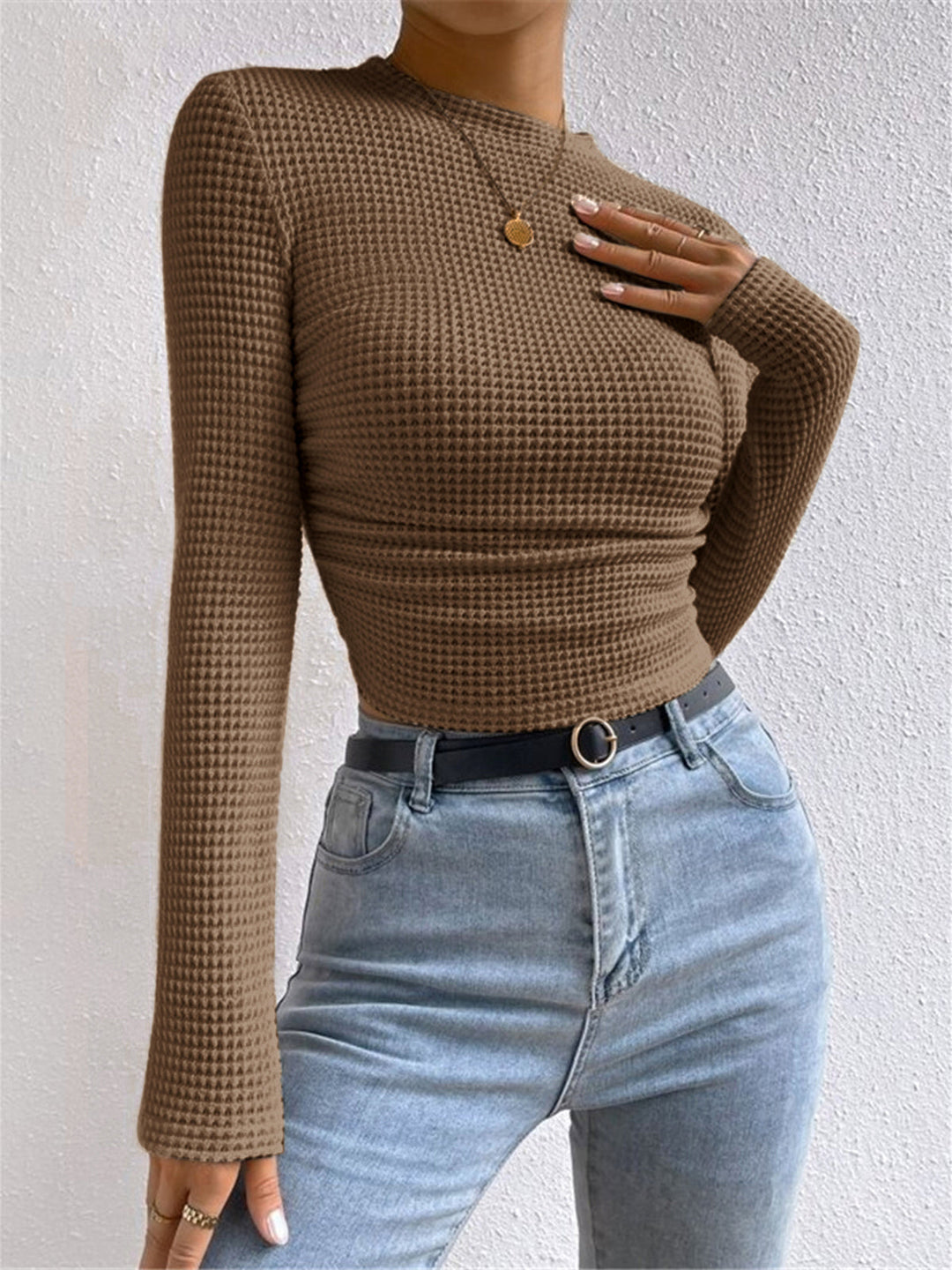 Relaxed fit women's long sleeve waffle top, offering cozy comfort for daily casual wear.