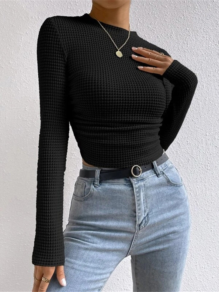Cozy women's cropped long sleeve waffle shirt, a must-have for winter style and comfort.
