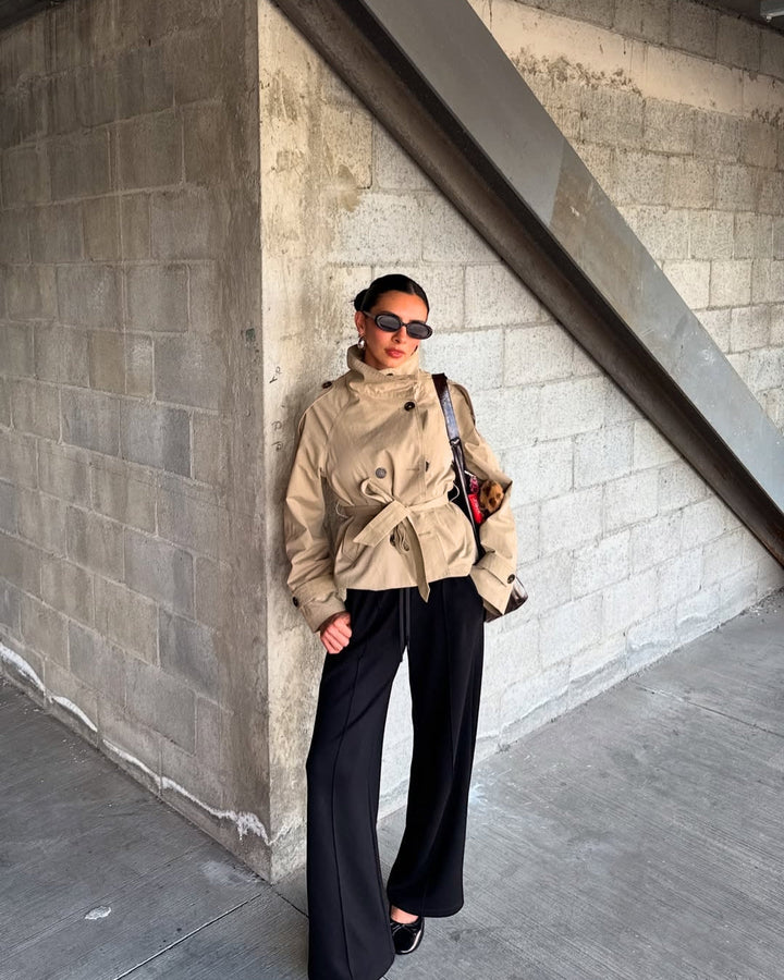 Women's cropped double-breasted trench coat with belt, perfect for fall fashion.