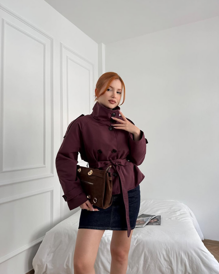 Modern women's cropped belted trench coat, double-breasted, ideal for versatile fall outerwear.