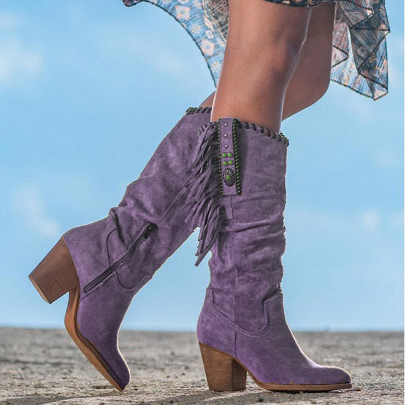 Stylish women's knee-high western boots for autumn/winter. Features pointed toe, block heel, and zip closure.