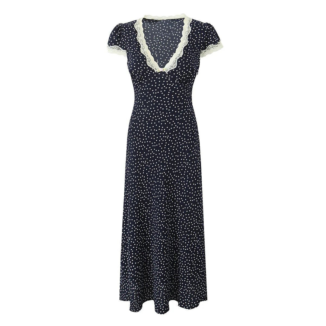 Elegant women's dark blue polka dot midi dress. Flutter sleeves & comfortable design for effortless summer style.