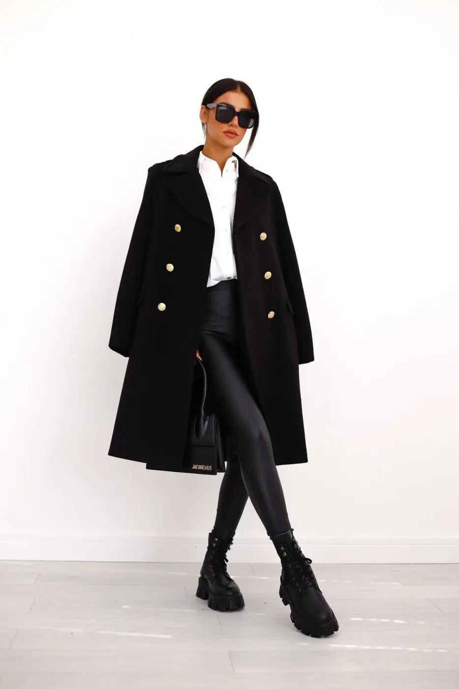 Women's double-breasted long tailored coat, elegant winter outerwear.
