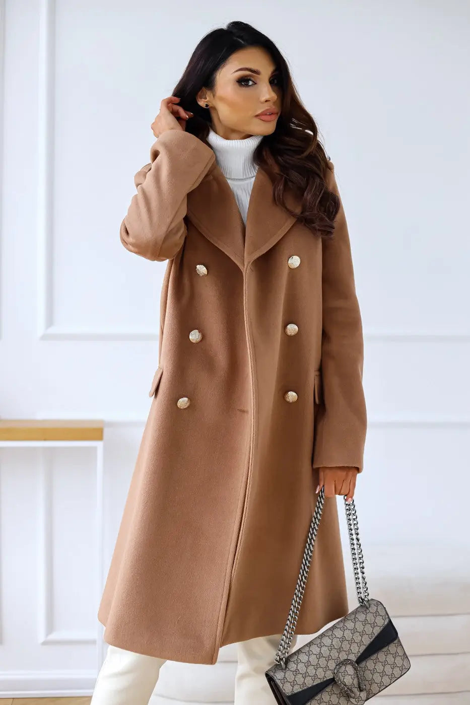 Stylish long tailored coat for women, double-breasted, perfect for formal occasions.