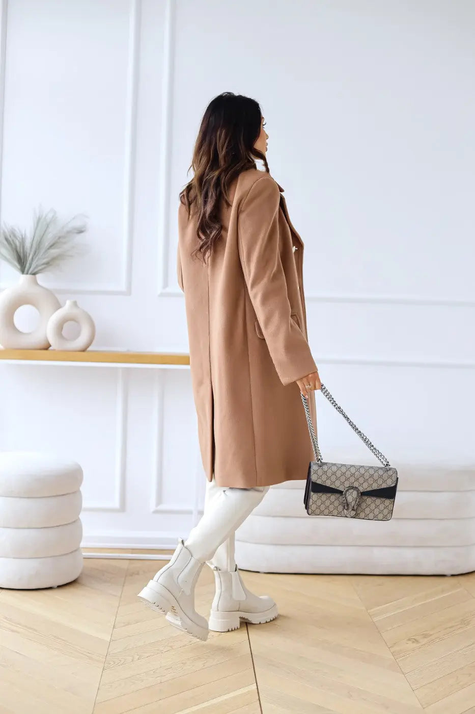 Formal women's long tailored coat, double-breasted design for a chic winter look.
