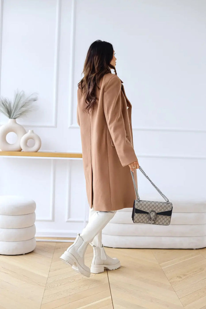 Formal women's long tailored coat, double-breasted design for a chic winter look.