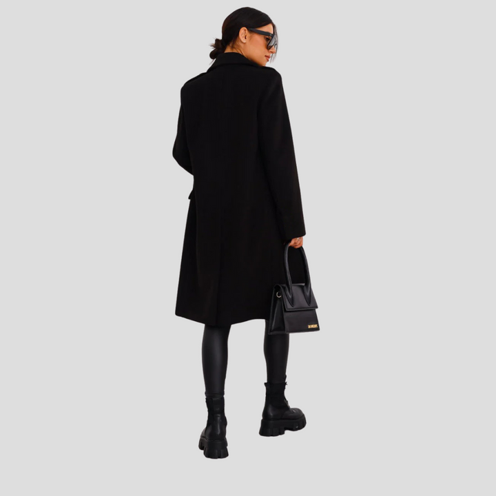 Tailored double-breasted women's long winter coat, elegant and classic outerwear for cooler weather.