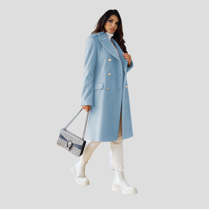 Elegant women's double-breasted long winter coat, a classic tailored piece for refined fall attire.