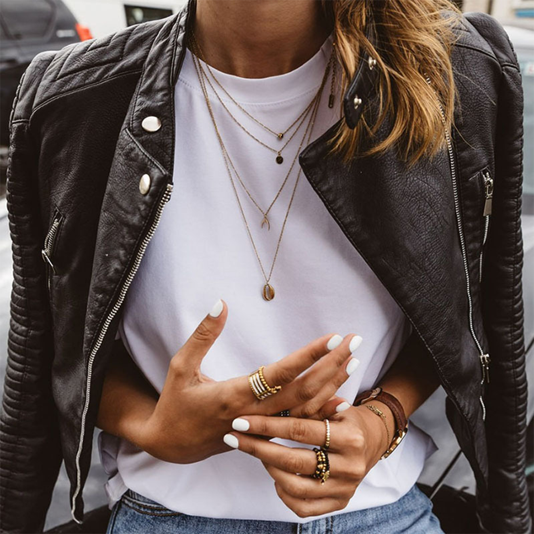 Modern design black women's jacket, a stylish fitted biker jacket with distinctive zip accents.