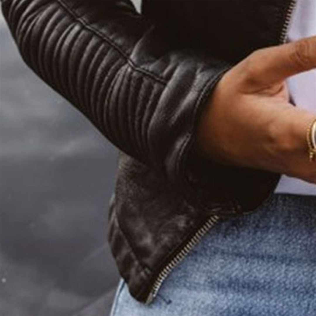 All-season black women's biker jacket, edgy design & modern zip details. Chic fitted outerwear.