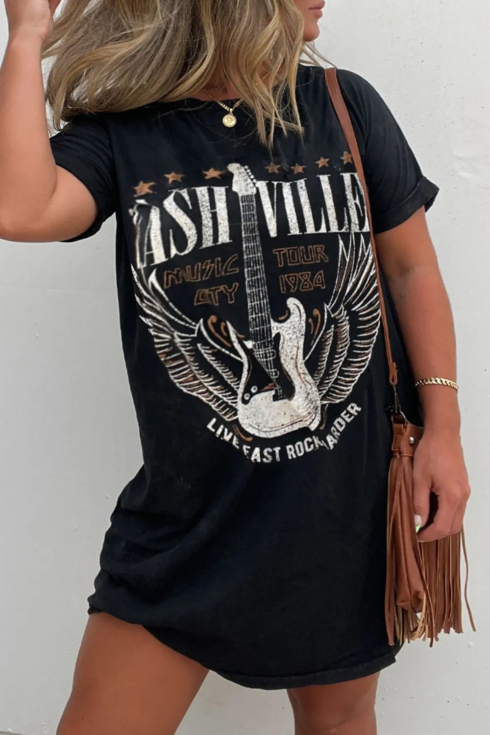 Oversized short sleeve black graphic tee dress for women, ideal for casual everyday wear.