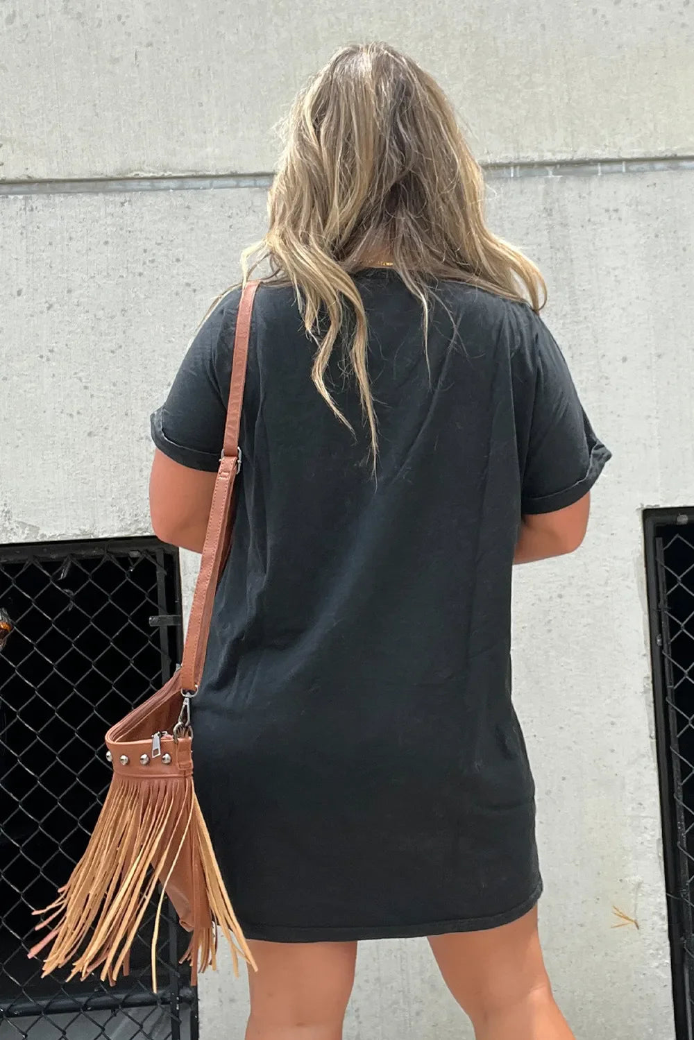 Edgy women's mini tee dress with bold graphic print, a versatile choice for street fashion.