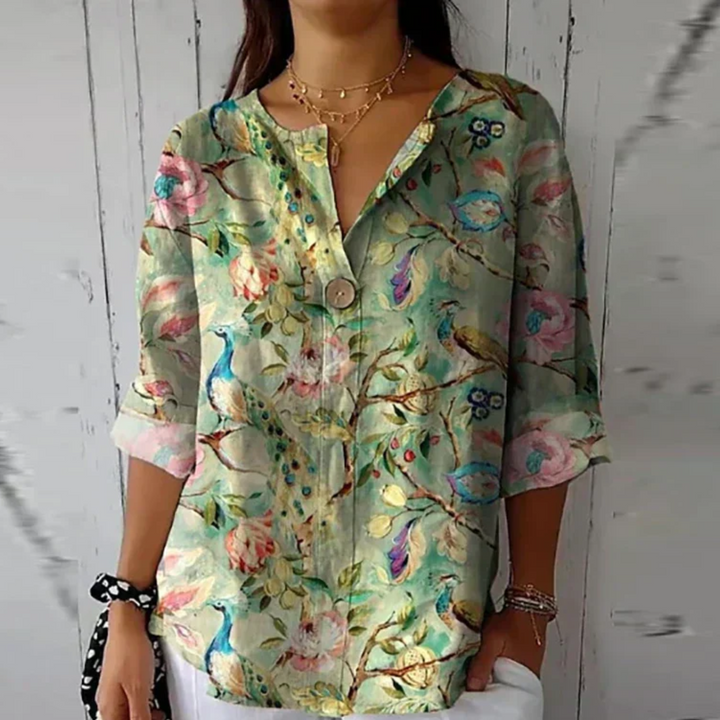 Vibrant floral print women's long sleeve blouse, offering effortless chic and versatile style.