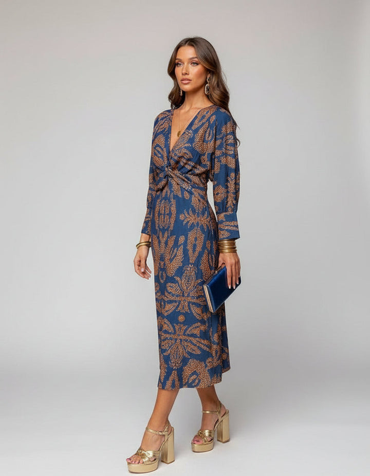 Women's effortlessly stylish boho wrap dress. Flowy midi length, ideal for summer casual fashion.