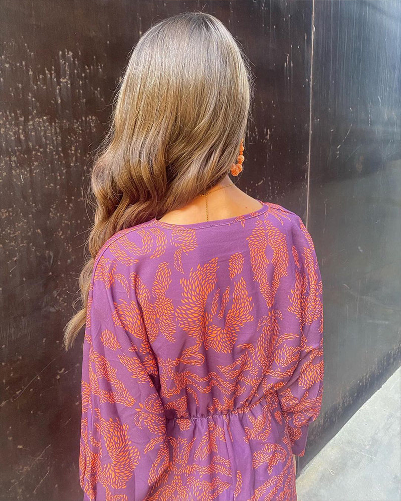 Comfortable flowy wrap dress for women. This elegant boho midi dress is ideal for summer fashion.