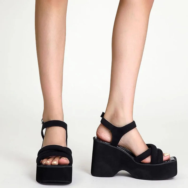 Black women's comfort sandals, elegant and fashionable summer footwear for casual chic styling.