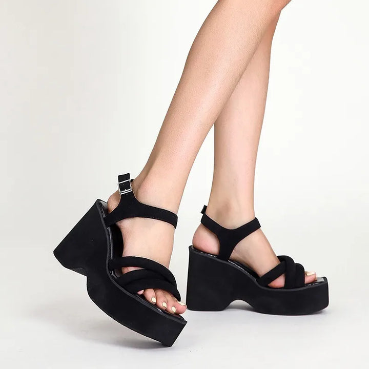 Women's black elegant comfort sandals, a must-have for summer footwear with a cushioned, stylish design.
