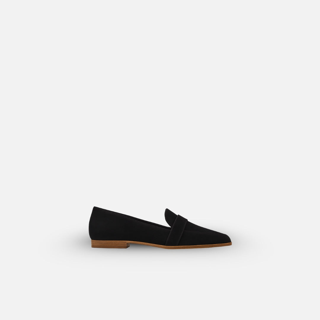 Women's elegant black loafers. Classic, comfortable slip-on shoes for everyday wear, casual or formal.