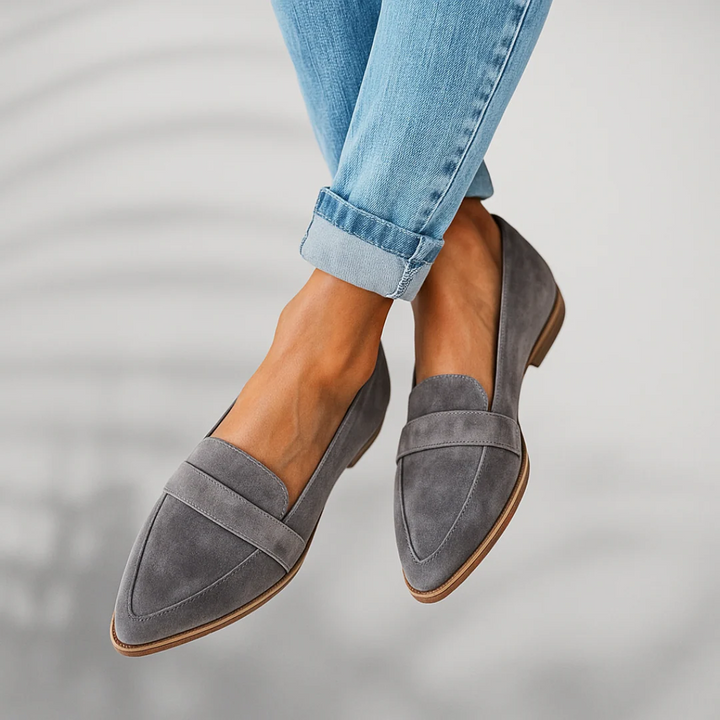 Elegant women's loafers. Classic black slip-on shoes offering comfort for both casual and formal occasions.