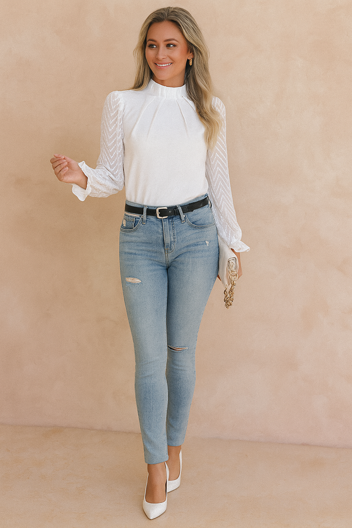 Chic women's blouse with sheer chevron long sleeves & high neck. Perfect for work or an elegant evening out.