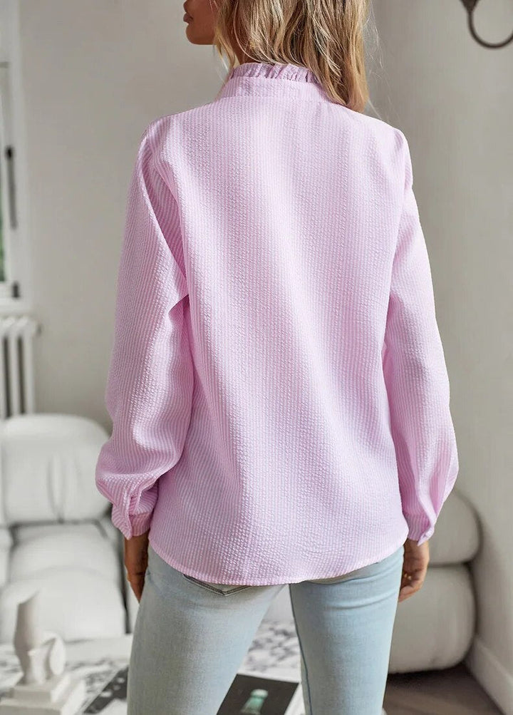 Elegant women's blouse paired with accessories. Comfortable & timeless style top, perfect for a sophisticated look.