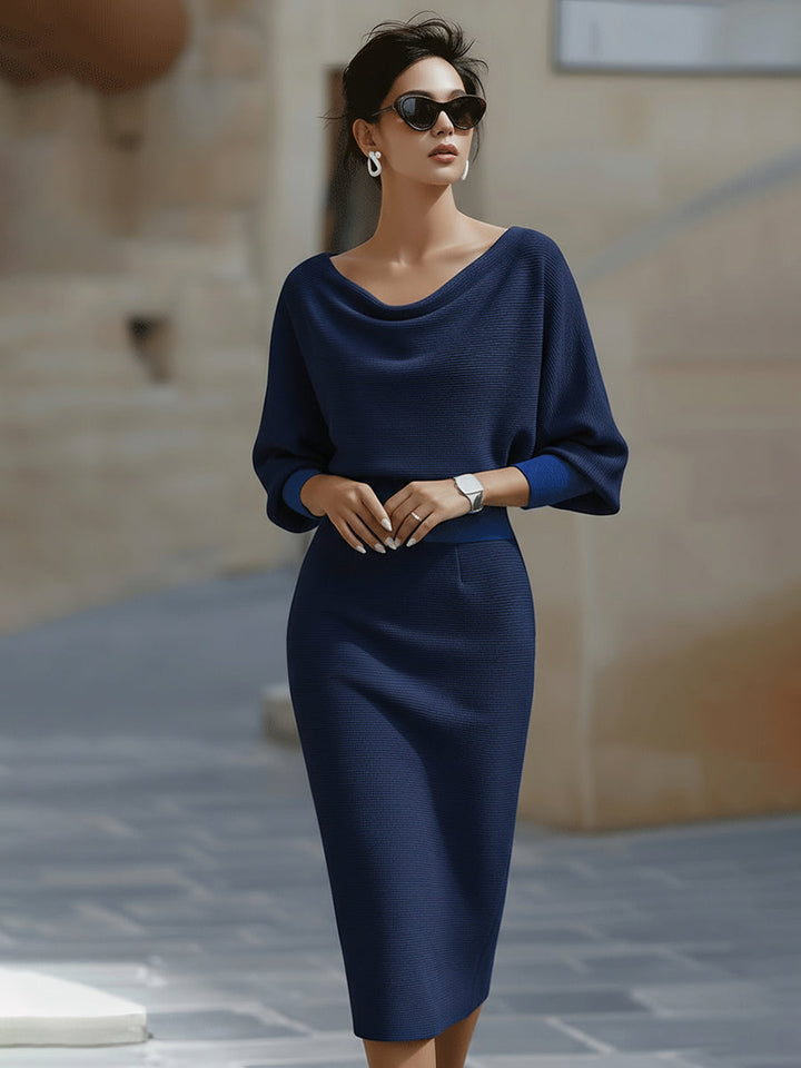 Sophisticated women's long sleeve midi dress featuring an elegant draped neckline & stylish batwing sleeves.