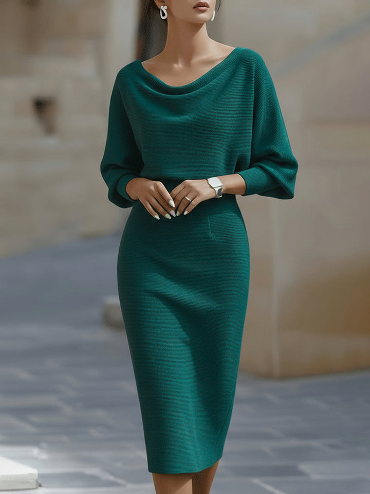 Fashionable women's long sleeve midi dress, elegant with draped detailing & stylish batwing sleeves. Cocktail/work.