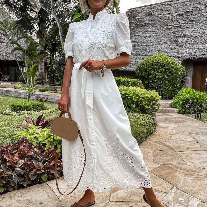 Blue flowy maxi dress for women, elegantly embroidered, ideal for summer, beach, or casual wear.