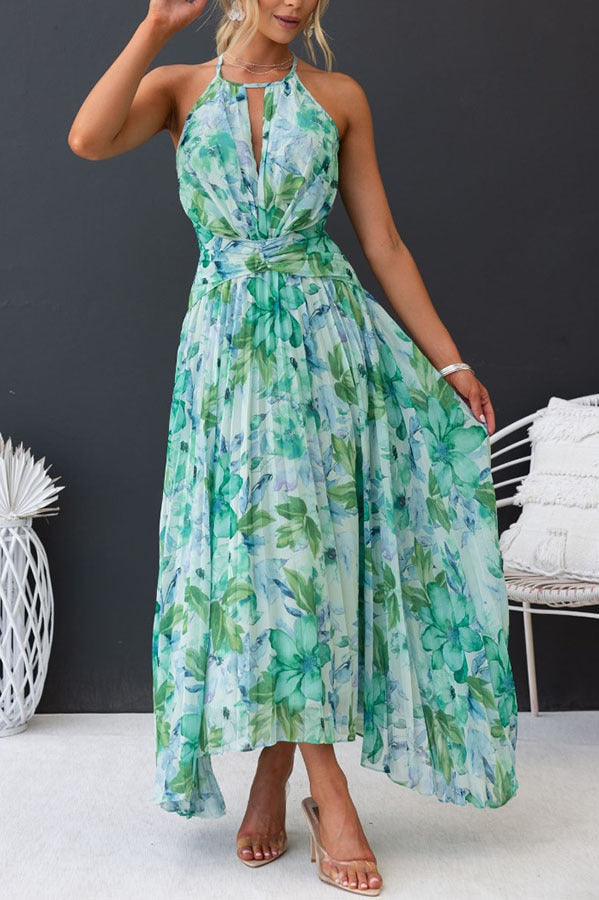 Stylish women's spring floral halter midi dress, perfect as a wedding guest or elegant party dress.