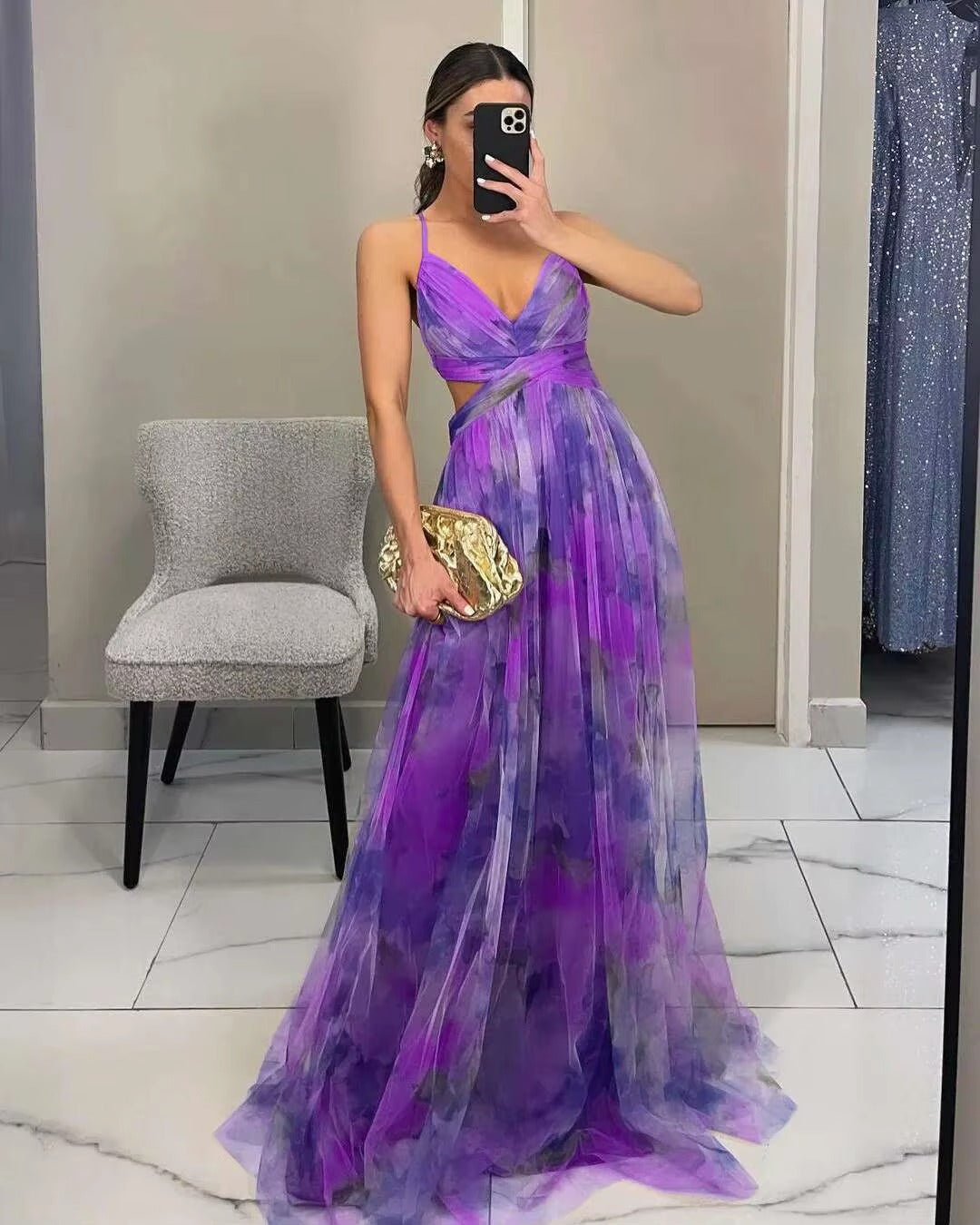 Back view of a women's elegant floral maxi dress, sleeveless floor-length design. Ideal as an evening gown or party dress.