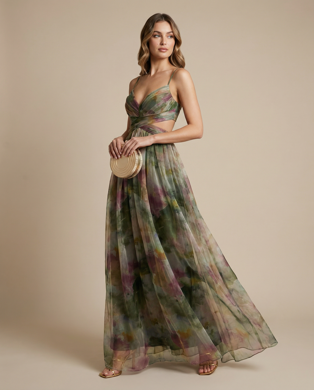 Elegant women's floral maxi dress styled for a summer evening party. Perfect sleeveless wedding guest attire.