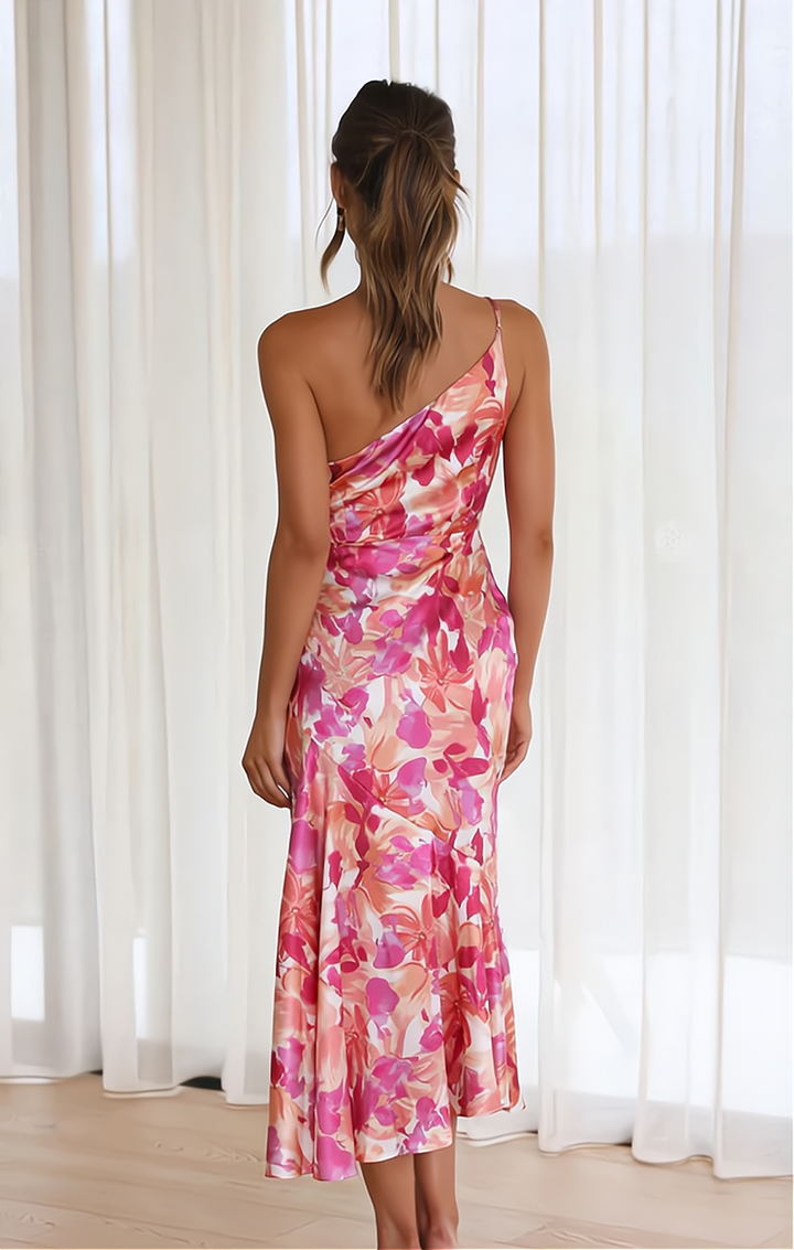 Close-up of a trendy Zoë off-shoulder floral summer dress, showing elegant design and vibrant print detail.