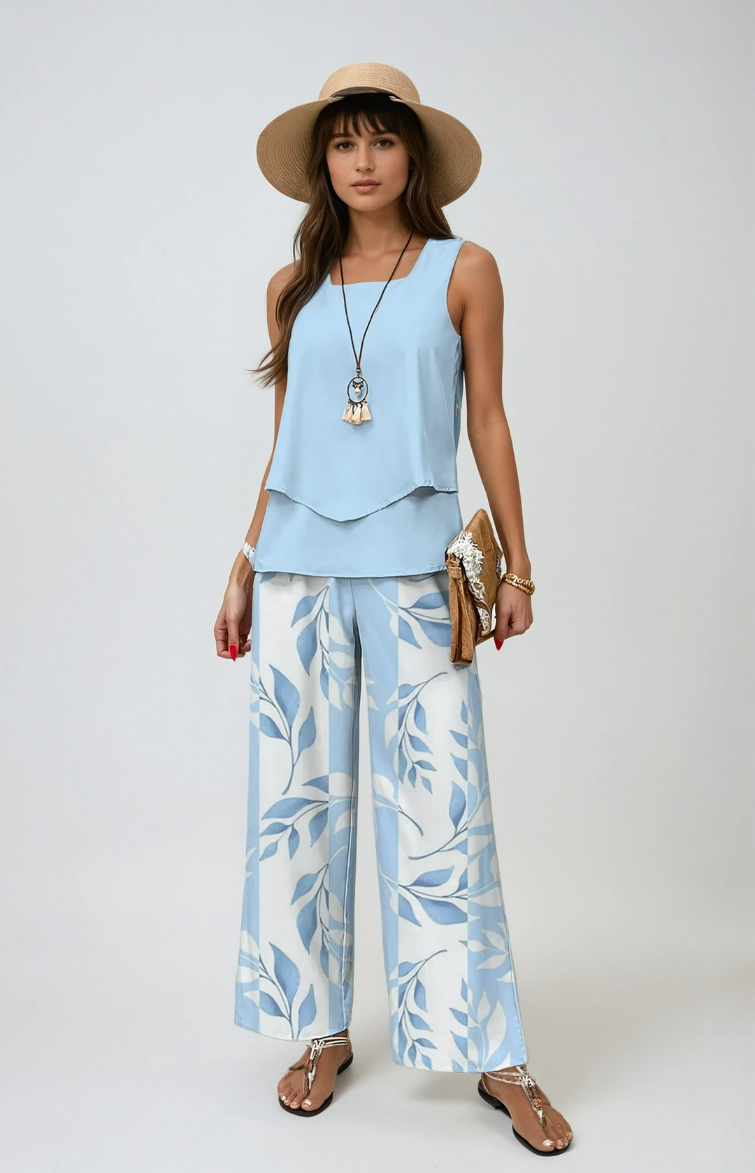 Women's elegant floral two-piece summer set with wide-leg trousers & layered top, perfect for resort wear.