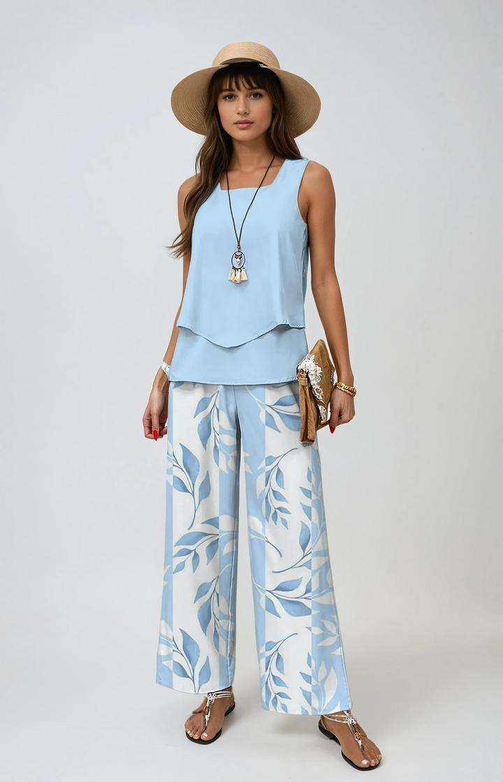 Women's elegant floral two-piece summer set with wide-leg trousers & layered top, perfect for resort wear.