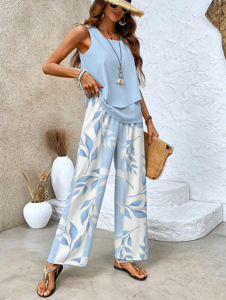 Chic women's floral two-piece set with wide-leg trousers & a stylish layered top for summer casual wear.