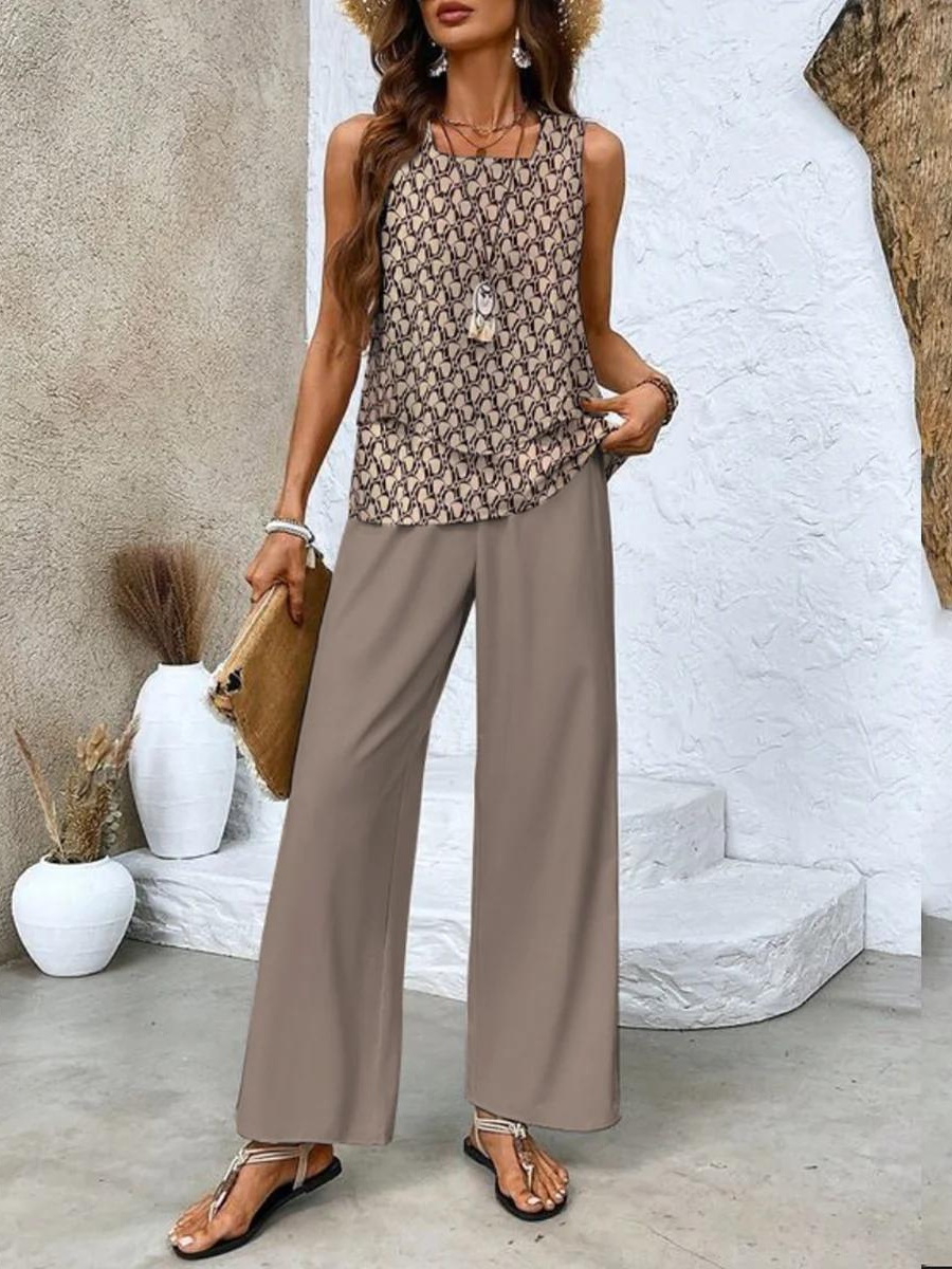 Stylish women's floral two-piece summer outfit, ideal for casual wear or resort vacations. Wide-leg trousers.