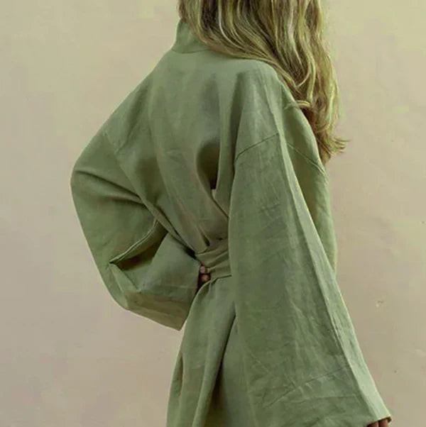 Stylish women's short kimono dress with a flowy design, ideal for elegant or casual summer wear.