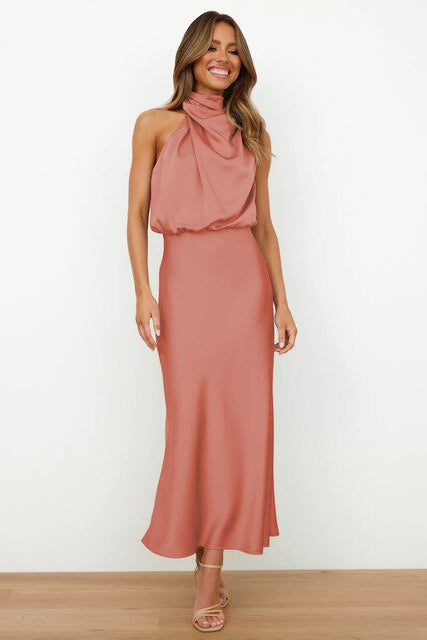 Women's sleeveless halter neck midi dress for formal events, offering a classic & elegant silhouette.