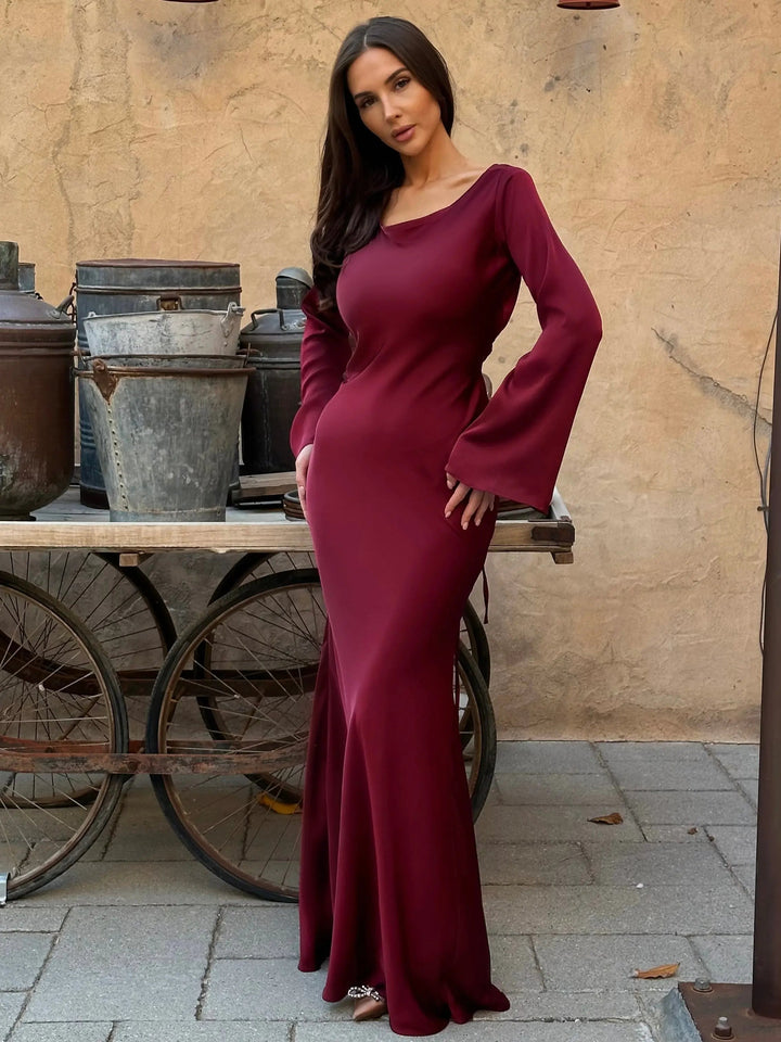 Graceful flowing elegant long sleeve maxi dress for women, perfect for a sophisticated formal or evening event.